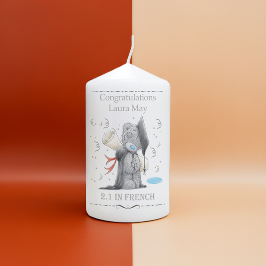 Personalized candle with a cartoon character and text on a two-tone background