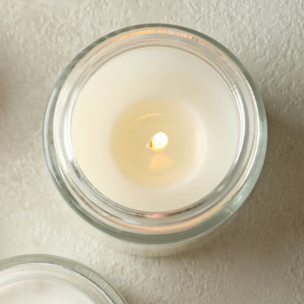Art Soy Candle in Clear Glass Jar Handmade Scented Candle with Original Clay Artwork, Earthy Fragrance, wedding favour, Minimalist Home Décor - Artfully Curated Creations and identify whats in the image