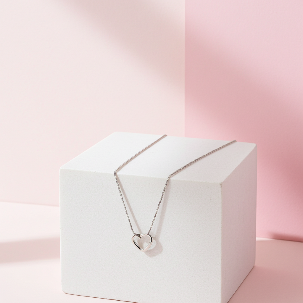 Personalised Sterling Silver Heart Necklace | Engraved Chrome Gift Box - Artfully Curated Creations and identify whats in the image