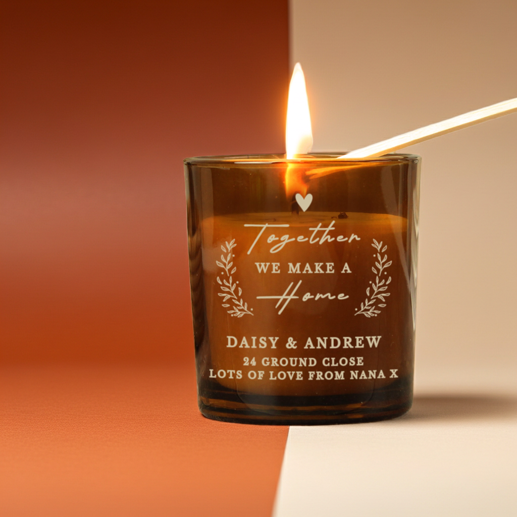 Personalised “Together We Make a Home” Amber Glass Candle Jar | Custom Housewarming Gift - Artfully Curated Creations and identify whats in the image