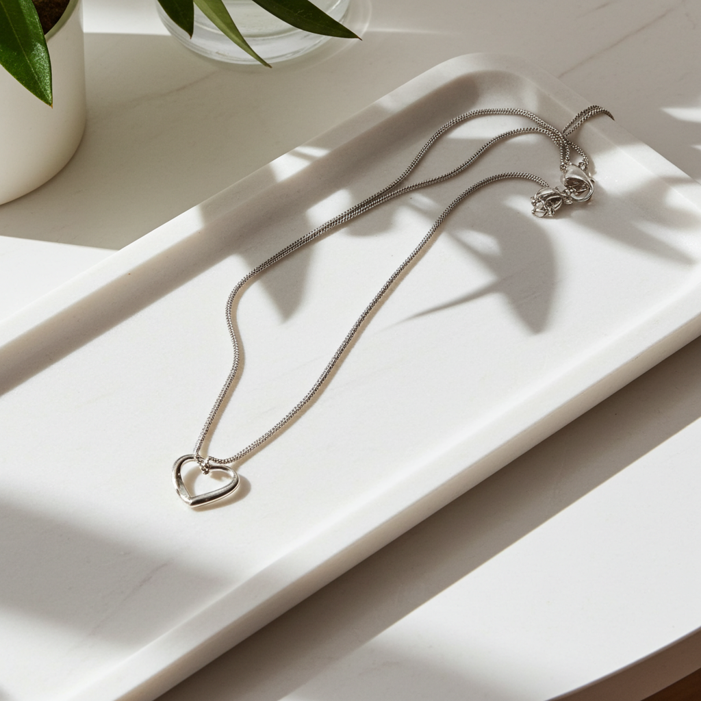 Personalised Sterling Silver Heart Necklace | Engraved Chrome Gift Box - Artfully Curated Creations and identify whats in the image
