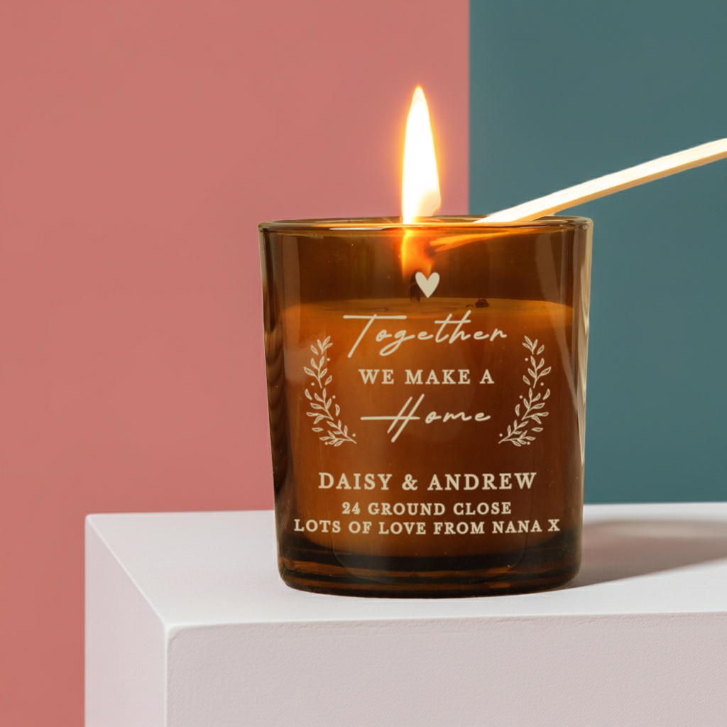 Personalised “Together We Make a Home” Amber Glass Candle Jar | Custom Housewarming Gift - Artfully Curated Creations and identify whats in the image
