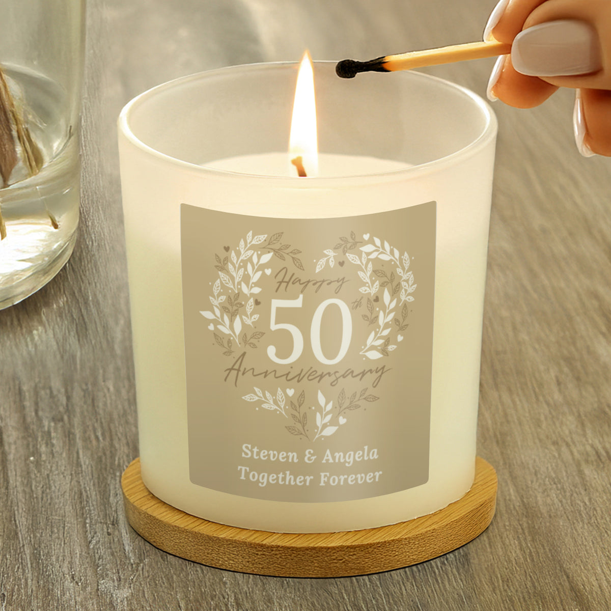 Personalised 50th Anniversary Vanilla Candle Jar | Golden Anniversary Keepsake - Artfully Curated Creations and identify whats in the image